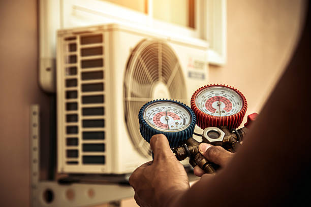 Professional Air Conditioning Service technician working in Oakwood, GA